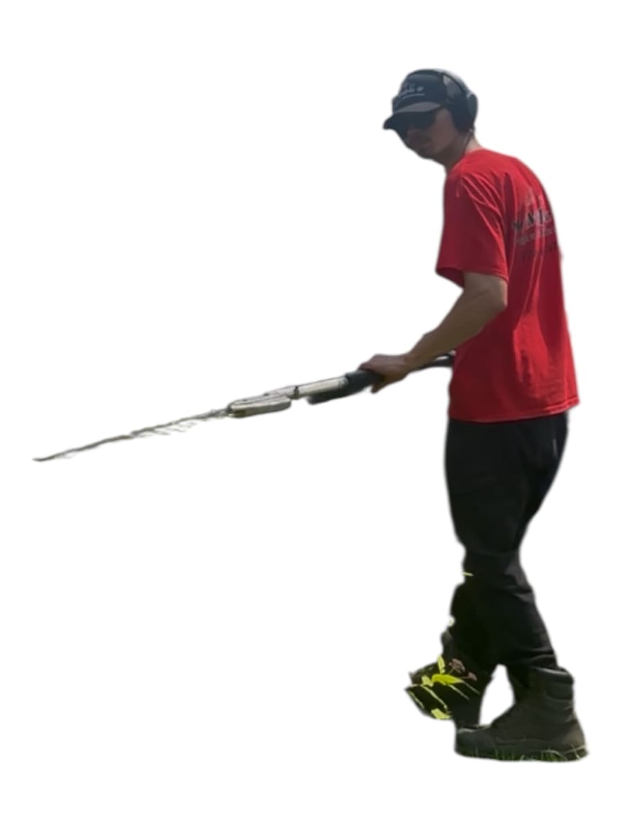Maple Property Maintenance crew member with hedge trimmers