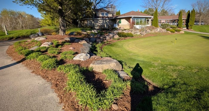 After: Mulch bed refresh at a golf club entrance
