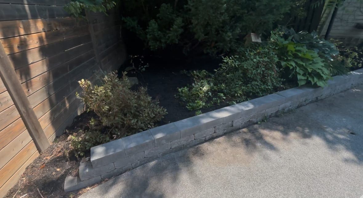 Finished retaining wall and garden bed edging by Maple Property Maintenance