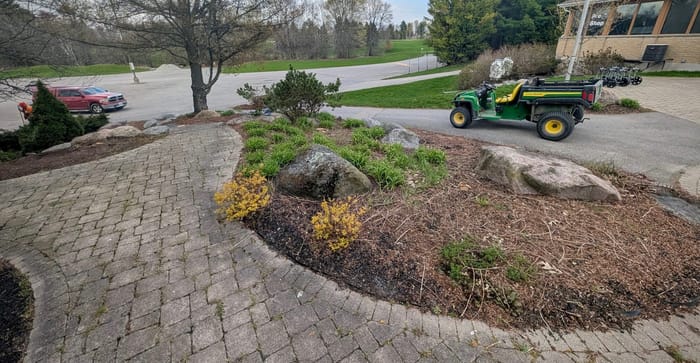Before: Entrance bed mulch installation